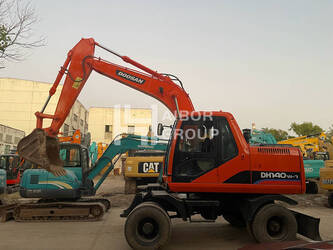 صورة ل حفارات بعجلات 2024 دايو / دوسان DH140W-7