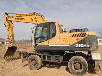صورة ل حفارات بعجلات 2022 هيونداي R210W-9